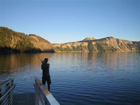 Fishing At Sunset Crater Lake Oregon Scenic Travel Travel Pictures