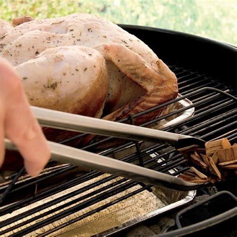 from prep to charcoal to wood chips see how to smoke a whole turkey on a charcoal grill in this