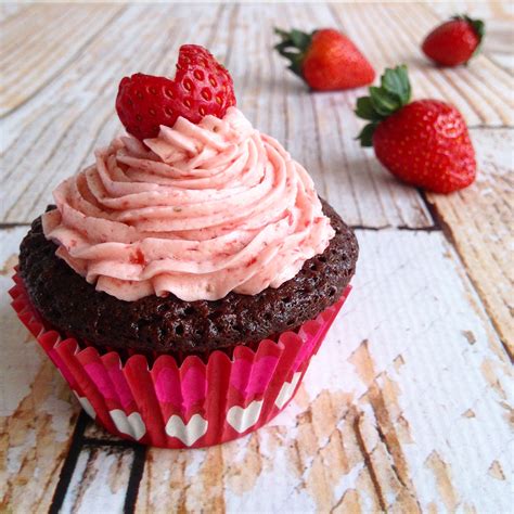 strawberry and chocolate filled classic chocolate cupcakes with strawberry frosting sweet is
