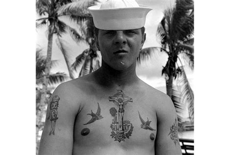 A Us Sailor Displaying His Tattoos While On Bikini Atoll Marshall