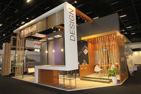 An Exhibit Booth With A Sign That Says Design On Its Front And Side Walls