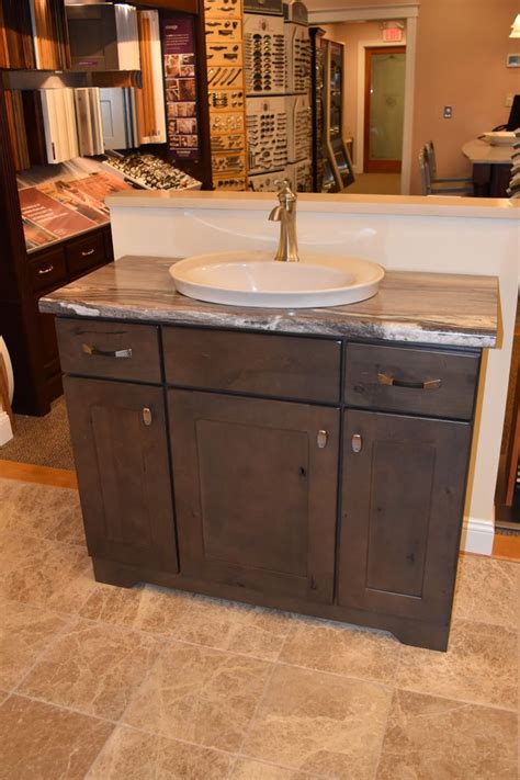 My warranty claim response from kraftmaid is that i damaged the product by neglect, which is not true. KraftMaid Putnam alder vanity cabinet in distressed canon ...