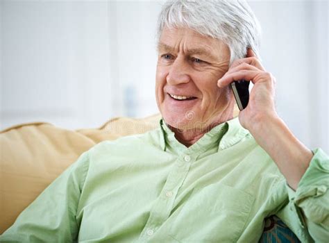 Your Call Made My Day An Elderly Man Talking On His Cellphone At Home Stock Image Image Of
