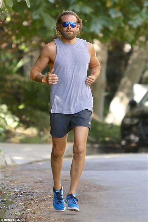 bradley cooper rocks polarizing hairstyle as he shows off sculpted figure during run daily