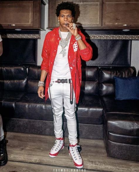 Rapper Lil Baby Spotted In A Moncler 8 X Palm Angels Red Patent Leather