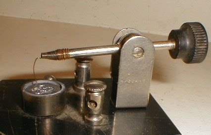 The cat's whisker detector is one of the most iconic components used in early radio sets. File:CatWhisker.jpg - Wikimedia Commons