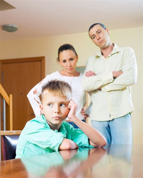 Parents Scolding Teenage Child In Home Photo Free Download