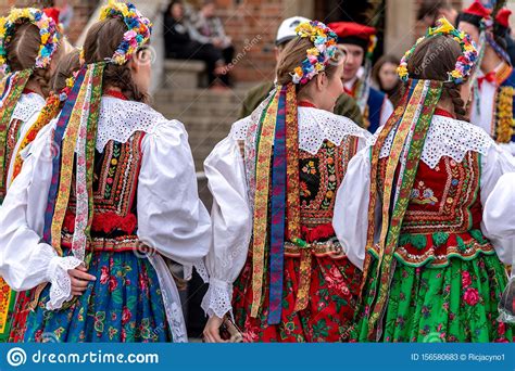 Traditional Polish Folk Costumes On Parade In Krakow Main Market Square