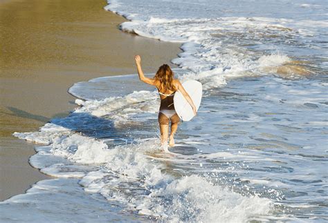 Woman Running Along Beach Photograph By Ben Welsh Fine Art America