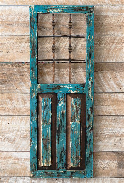 You can hang a single row of records across your wall. Turquoise Durango Door Wall Hanging