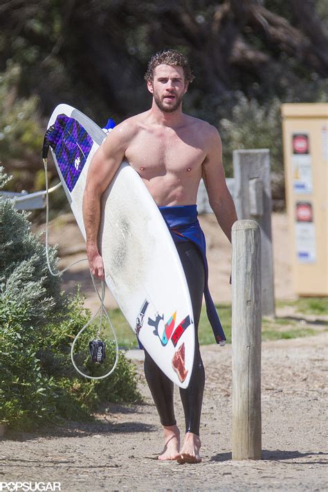 Liam Hemsworth Shirtless While Surfing In Australia Popsugar Celebrity