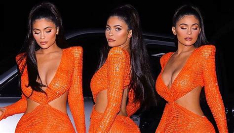 Kylie Jenner Sports 16917 Sheer Orange Dress For A Night Out Pics