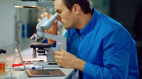 Male Scientist Looking Microscope In Lab Lab Man Using Scientist