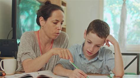 Mother Helping Son To Do Homework At Home Stock Footage Sbv 327180641