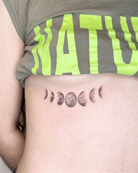 Micro Realistic Style Moon Phases Tattoo Located On The