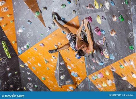 Young Male Rock Climber In Indoor Climbing Gym Stock Image Image Of