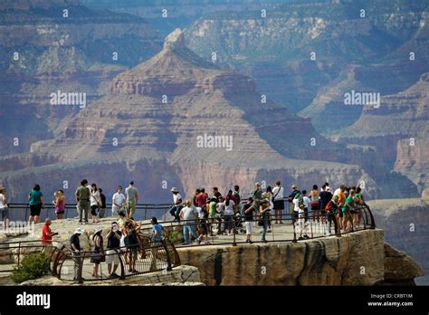 Tourists On Mather Point Lookout Overlooking Isis Temple Grand Canyon