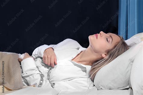girl tied with chain in bed sleep paralysis concept stock 写真 adobe stock