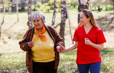 Elderly Woman And Young Caregiver Stock Photo Image Of Health Aging