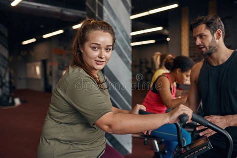 Male Trainer Tell To Girl Do Exercise On Orbitrek Stock Photo Image
