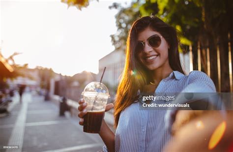 Beautiful Woman Drinking Coffee And Taking Selfies In The City High Res