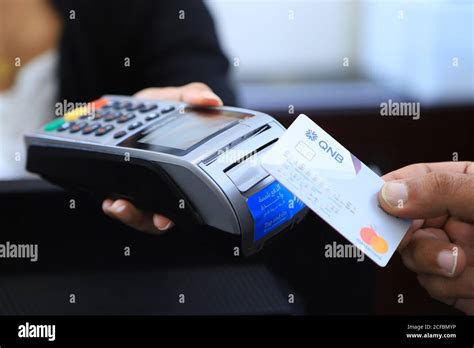 Atm And Debit Card Swipe Machine Qnb Stock Photo Alamy