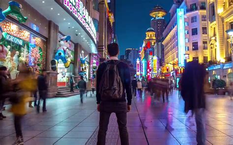Watch Trippy Magical Footage Of Man Walking Through Shanghai As City