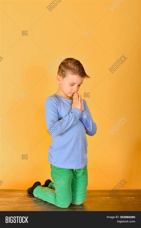 Boy Prays Kneeling Image And Photo Free Trial Bigstock