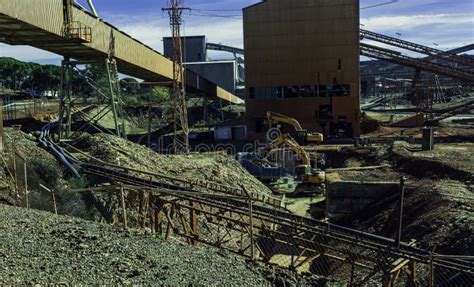 Yellow Mining Trucks At The Riotinto Mines Under The Sunlight At