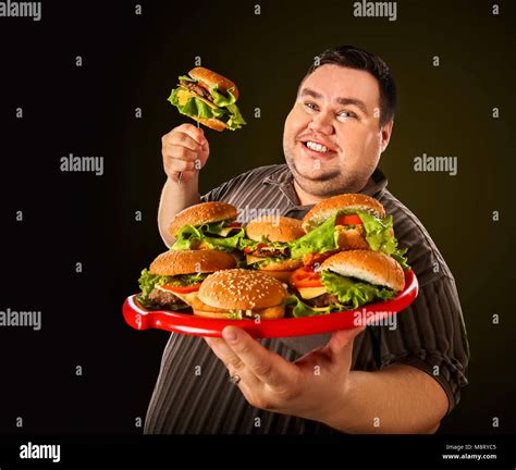Fat Man Eating Fast Food Hamberger Breakfast For Overweight Person Stock Photo Alamy
