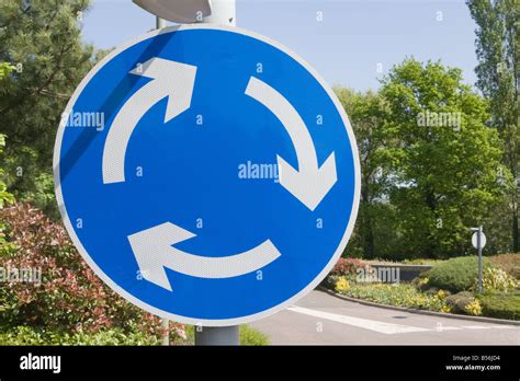 Traffic circle sign Stock Photo - Alamy