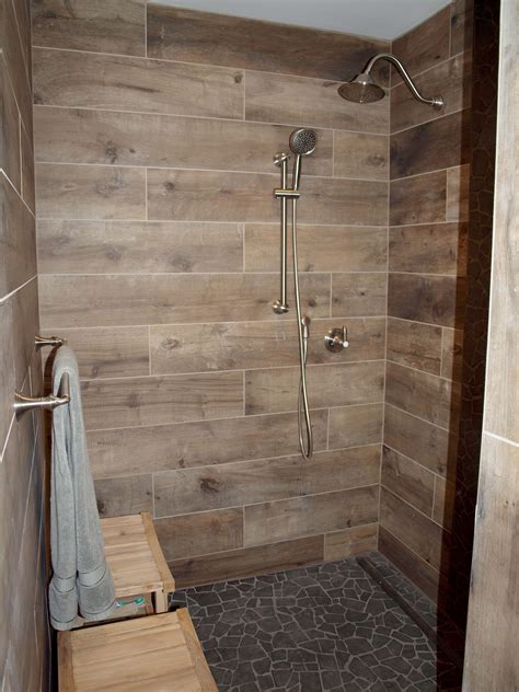 There's nothing that brings a bathroom together more than tiling a bathroom wall.#thehomedepot #homeimprovement #diysubscribe to the home depot. Wood-Look Tile on Walls : Normandy Remodeling