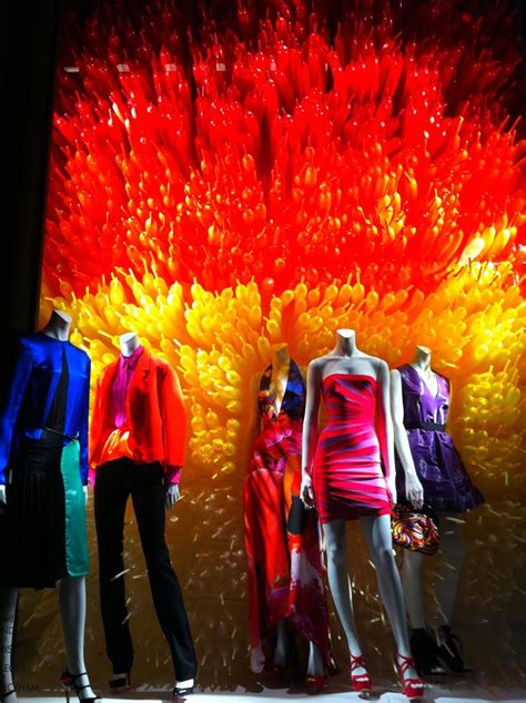 Several Mannequins Dressed In Bright Colored Clothing