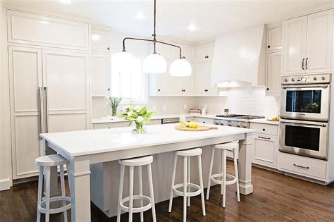 All styles and sizes of islands, kitchens and more. Stunning all white kitchen boasts a 3 light linear pendant ...