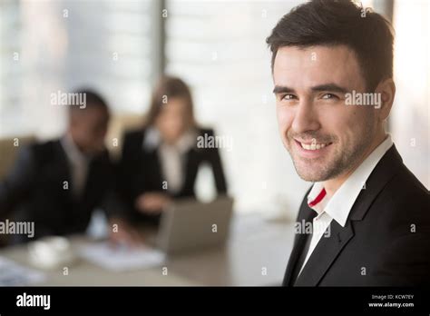 Headshot Portrait Of Successful Caucasian Businessman Looking At Camera Black Man And White