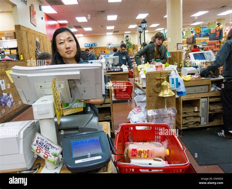 checkout clerk at Trader Joe's, Philadelphia, USA Stock Photo - Alamy