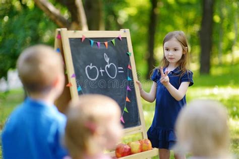 Adorable Little Girl Playing A Teacher Stock Photo Image Of Child