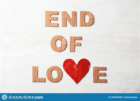 Don't know how to end your letter? Phrase `End Of Love` With Torn Cardboard Heart And Letters On Light Background, Top View Stock ...