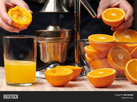 Squeezing Orange Image Photo Free Trial Bigstock