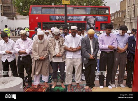 Muslim Men Pray In The Street Outside The East London Mosque In Whitechapel In The East End Of