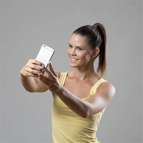 Young Happy Sporty Woman Taking Selfie Self Portrait With Smart Phone