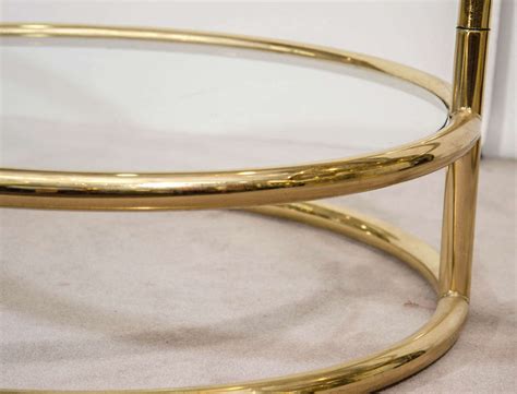 A rectangle coffee table is the most popular type of modern glass coffee table. A Mid Century Milo Baughman Style Three Tiered Brass and ...