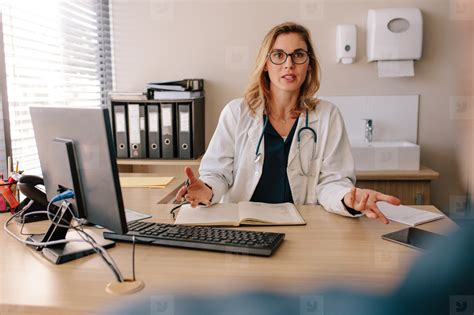 Female Doctor Consulting A Patient In Clinic Stock Photo 167347