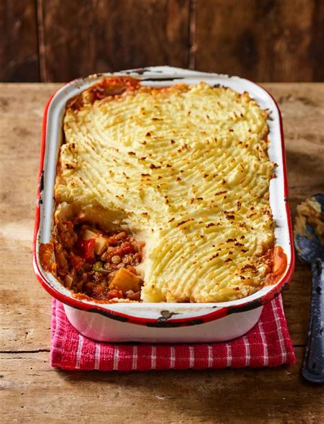 This naturally vegan lentil shepherd's pie is made by baking stewed lentils and vegetables with a garlic chive mashed potato topping. Vegan shepherd's pie recipe | Sainsbury's Magazine