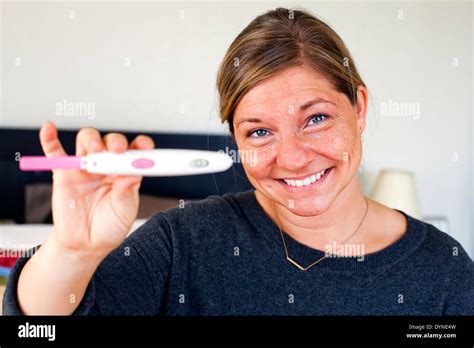 Caucasian Woman Holding Positive Pregnancy Test Stock Photo Alamy