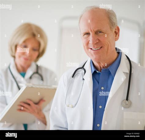 Senior Male Doctor With Stethoscope Around Neck Stock Photo Alamy