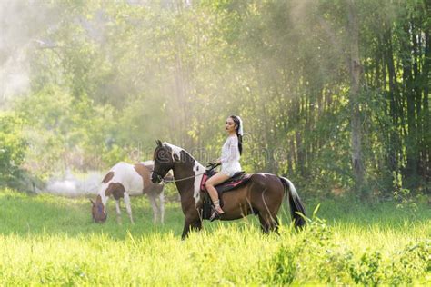 Young Woman In White Dress With Horse Woman Riding Red Horse In The