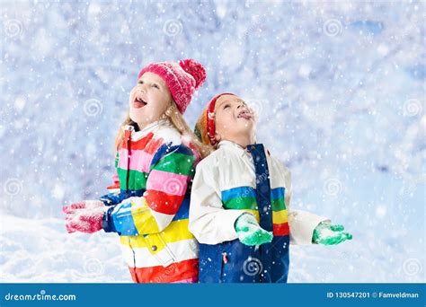 Child Playing With Snow In Winter Kids Outdoors Stock Image Image Cc4