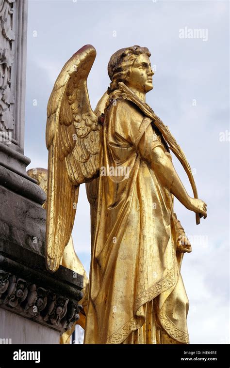 Golden Statue Of Angel On The Fountain In Front Of Cathedral Assumption