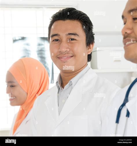 Portrait Of Medical Team Standing In Hospital Southeast Asian Muslim